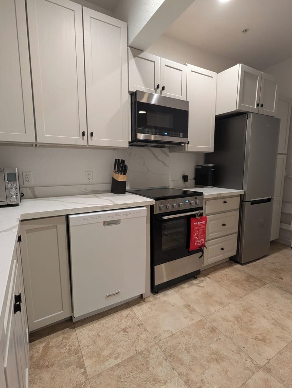Kitchen with stove, oven, dishwasher, fridge/freezer, microwave, and pantry