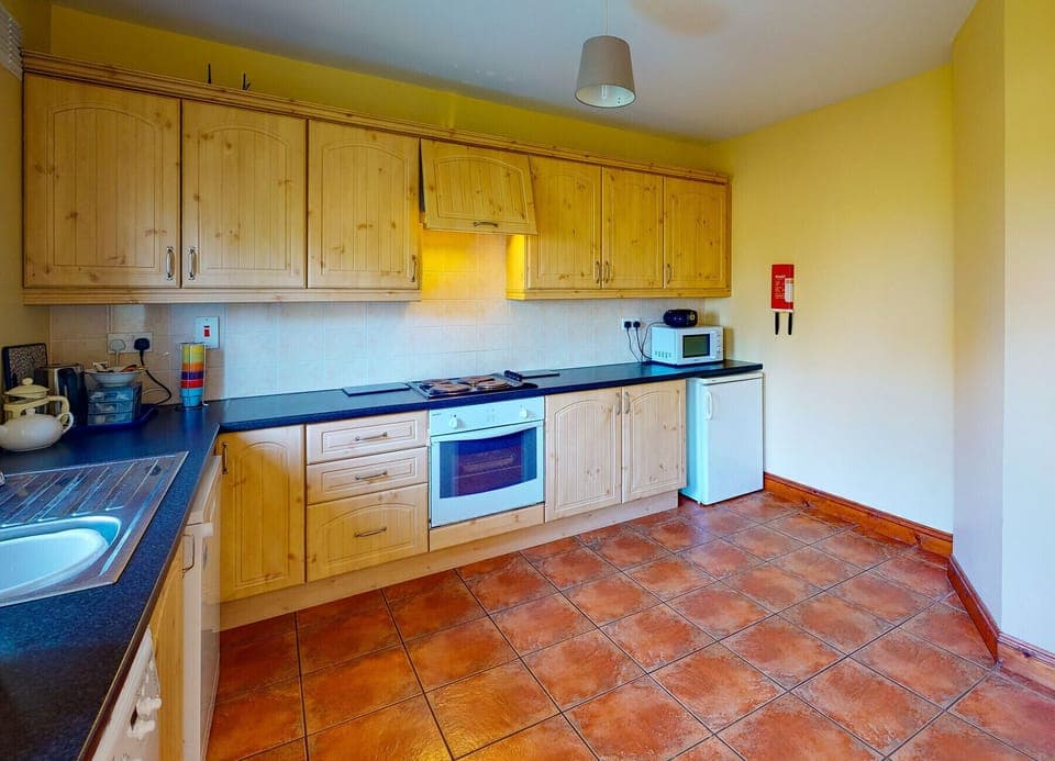Dunmore East, County Waterford, Ireland. Pine Kitchen, tiled floors, modern appliances.