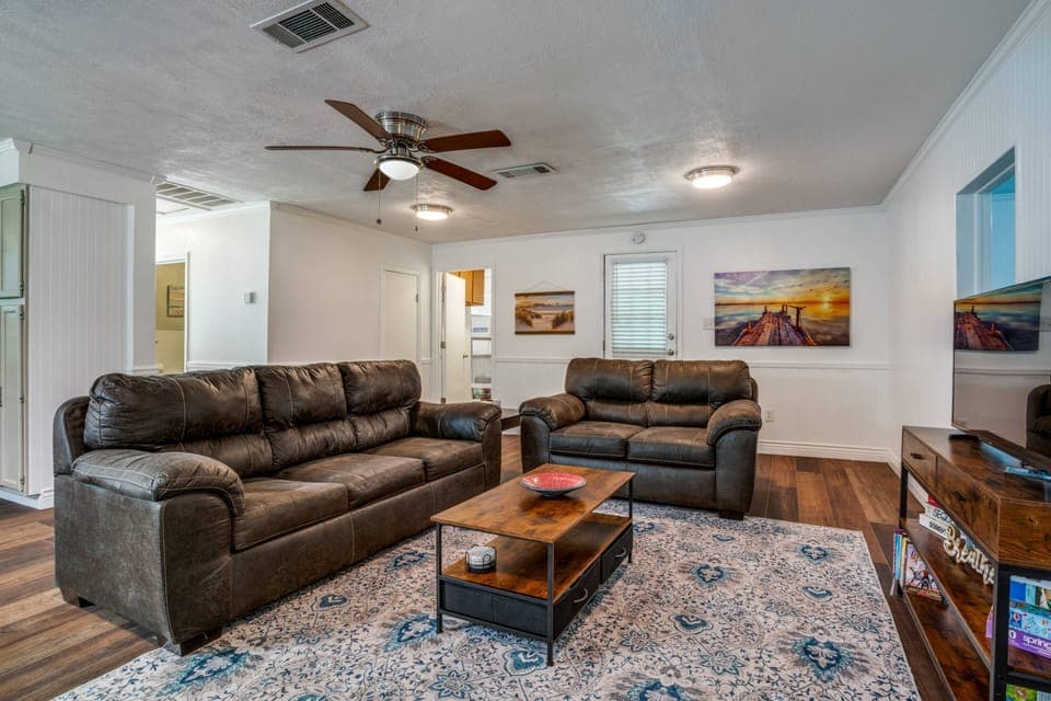 Open floor plan with cozy living room for watching TV, playing games enjoying time together.