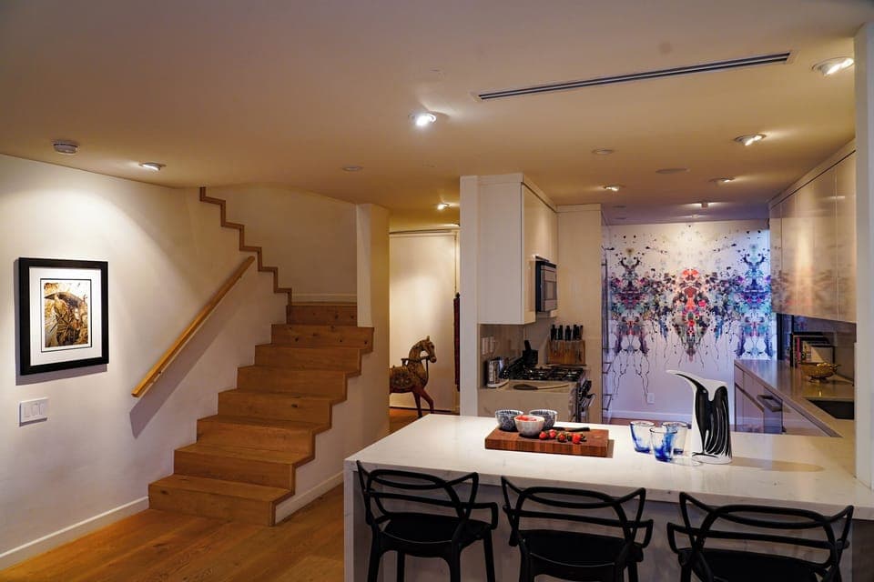 Kitchen counter and steps to upstairs bedroom and roof garden