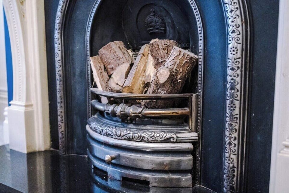 Warm up by the stylish fireplace – a perfect living room centerpiece.