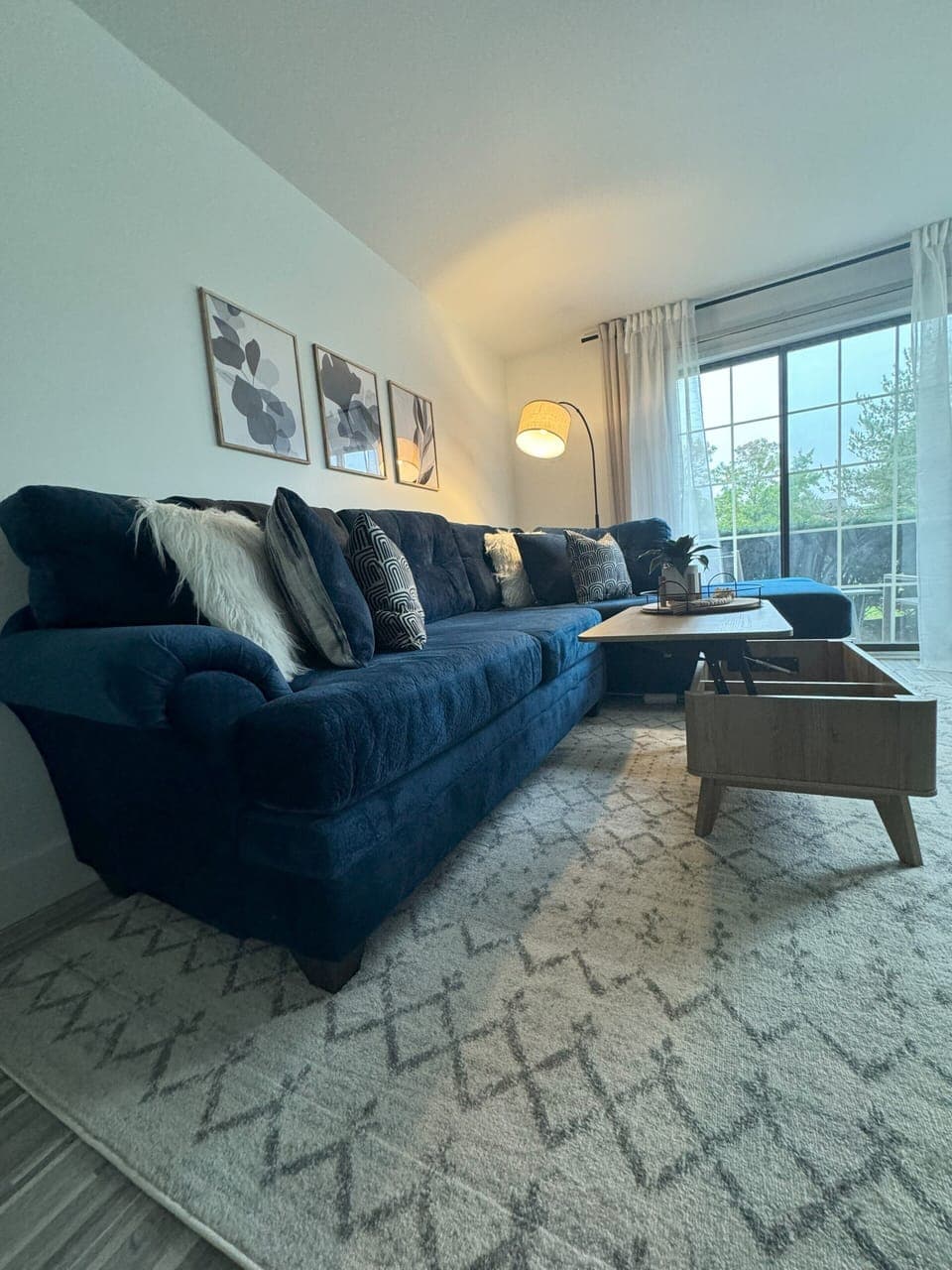 Living Room w/ The Most Comfortable Blue Sectional w/ Chaise and a Working Coffee Table