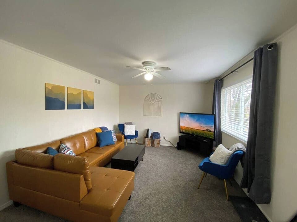 This living room aims to please! Watch your favorite shows on the smart TV or lay out a yoga mat for a workout.  