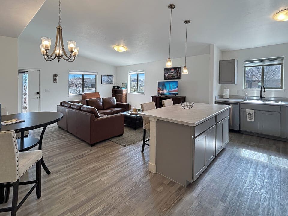 Settle into your bright open-concept space where your fully equipped kitchen island flows seamlessly into the cozy living room.