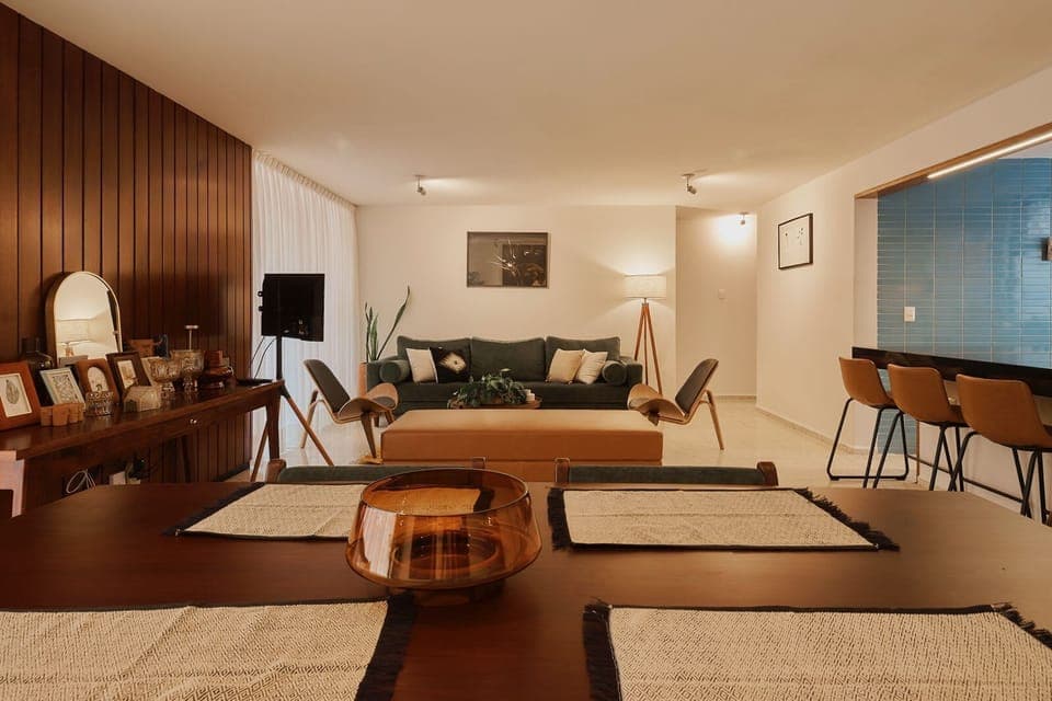 Dining and living area with access to a balcony and panoramic view.