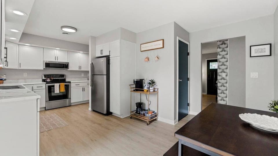 Dining area off of kitchen. Coffee cart with kurig and drip coffee available. 