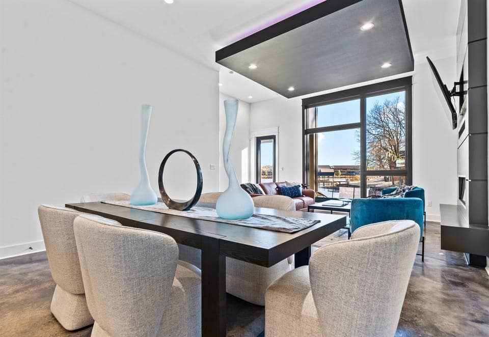 Sleek furnishings and eye-catching decor make this dining area an ideal spot for sharing meals, stories, and laughter.