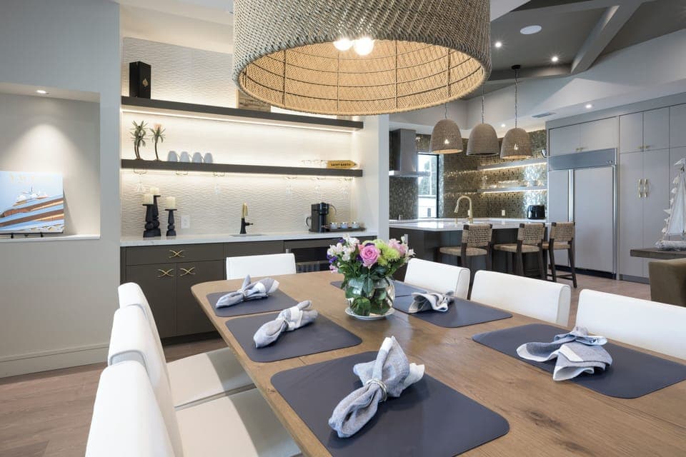 Open concept area with coffee station and wet bar and refrigerator