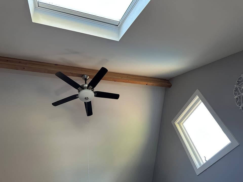 high ceilings and sky lights make this a very warm and cozy room 