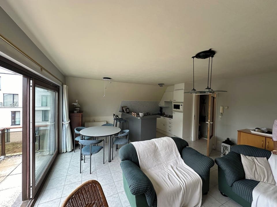 Living room, dining table and kitchen