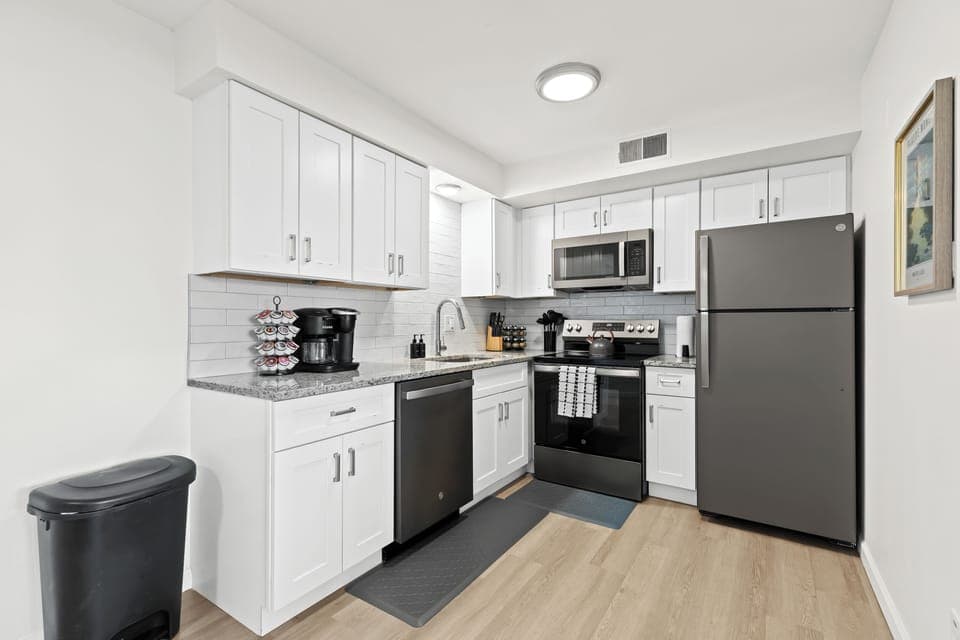 Enjoy a sleek, updated kitchen with stainless steel appliances, granite countertops, and everything you need to cook at home.