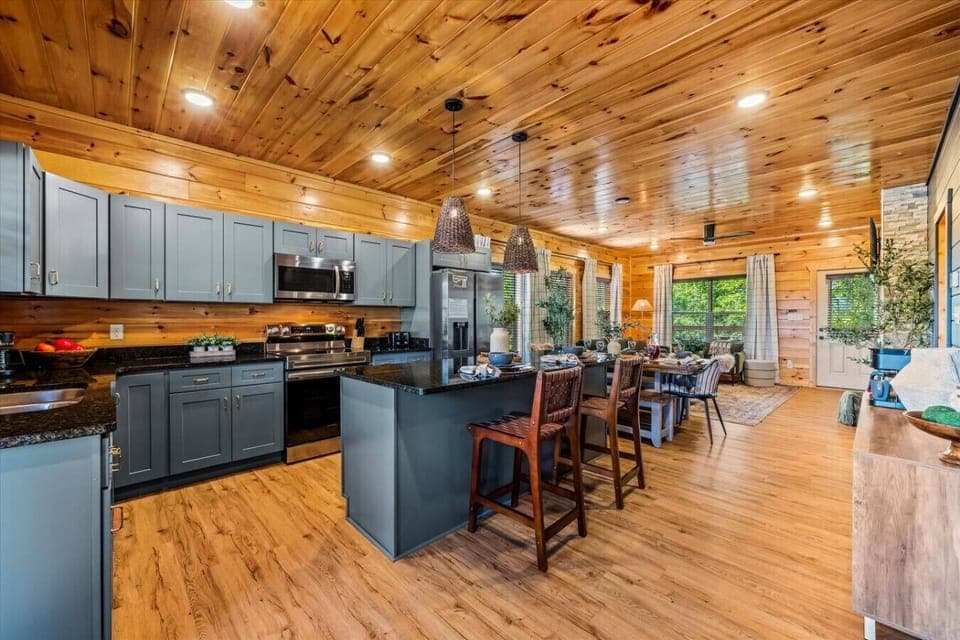 Enter the cabin through the beautifully designed kitchen, complete with stainless steel appliances and plenty of space to make meals and memories.