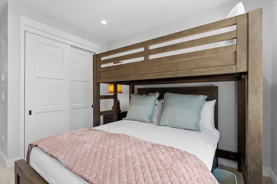 Top floor guest room featuring a twin XL over queen bunk bed, great for the kids! This bedroom also features a large walk-in closet.