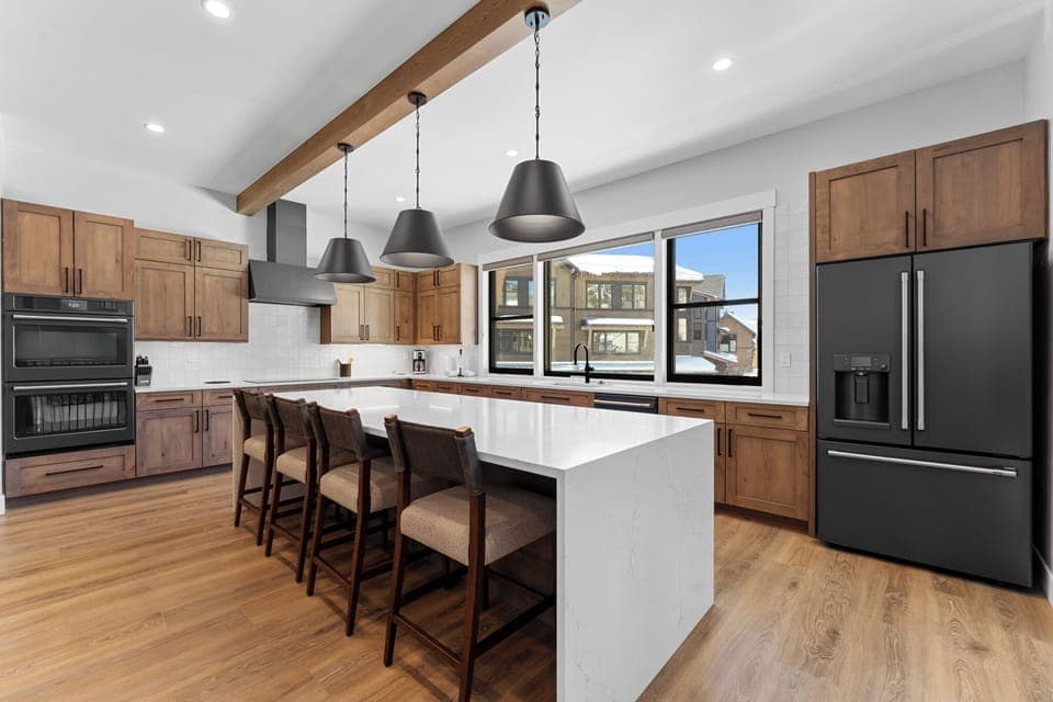 Full kitchen with quartzite counters. Smart appliances, and huge prep area!