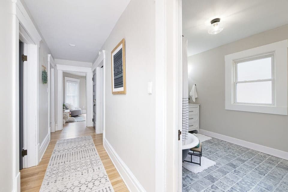 Bright and airy hallway with natural light, hardwood floors, and charming vintage details 🌿🚪 A welcoming path connecting the heart of the home to cozy, private rooms.