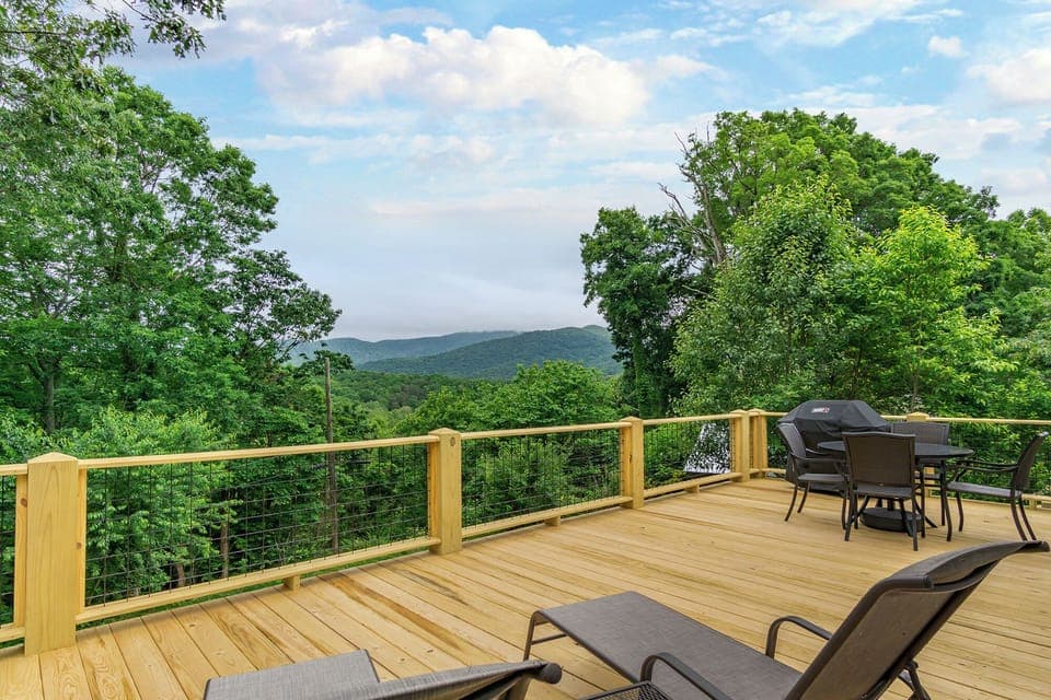 Spacious back deck with mountain views.