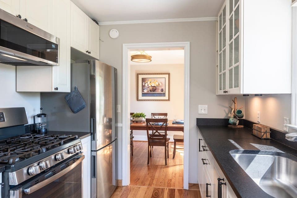 Prepare meals in the modern kitchen, equipped with stainless steel appliances and ample counter space.