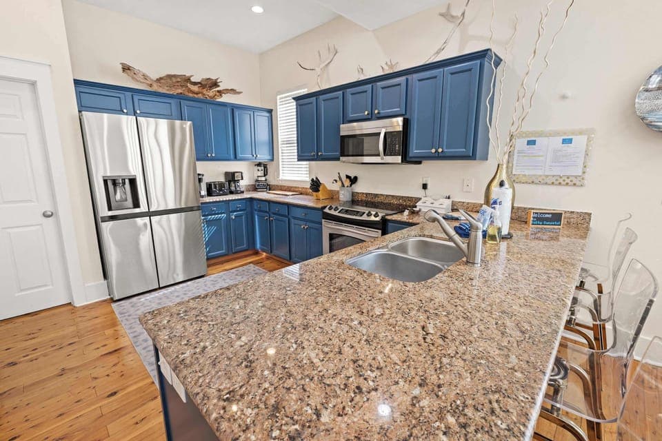 Kitchen: Keurig coffee maker, blender, toaster, toaster oven, cooking utensils, tableware