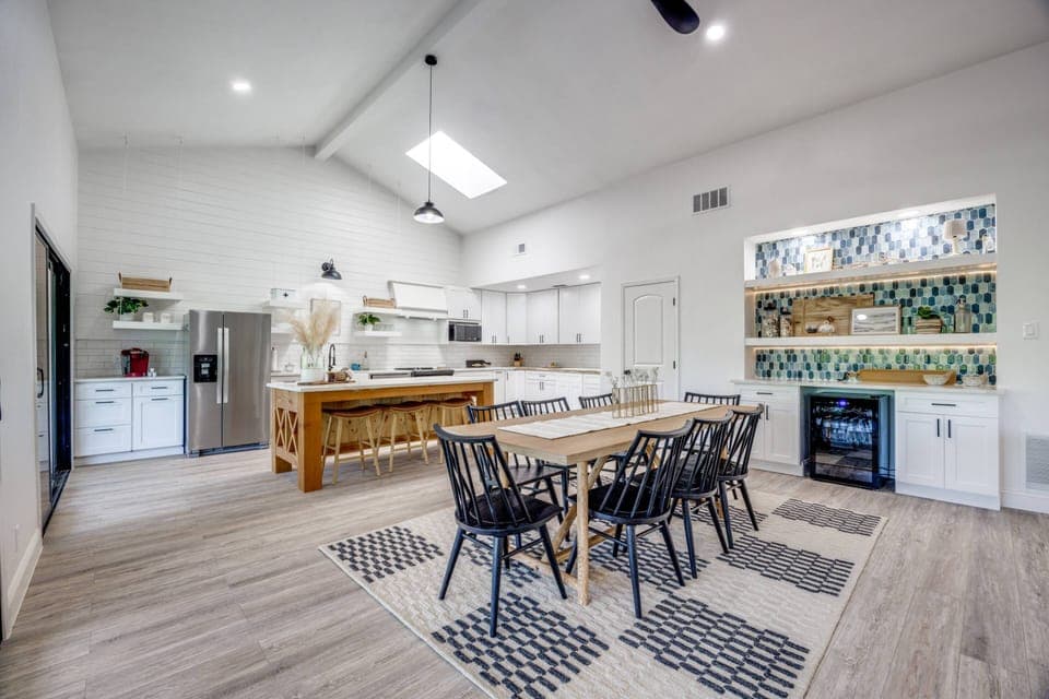 Kitchen: Cooking Basics, Dishware & Flatware, Keurig.  Dining Area: Large table with seating for 8, Wine/Beverage Fridge