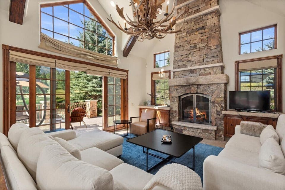 Bright Living Room with Fireplace & Mountain Views