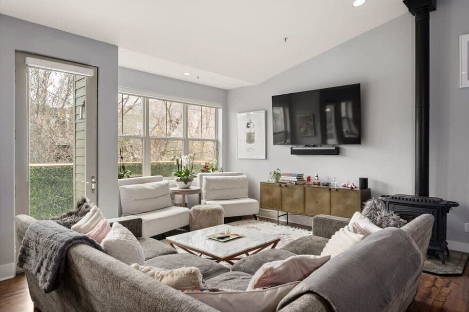 Living Room with Large Windows & TV