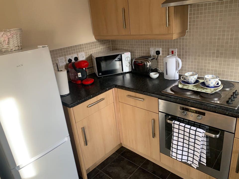 Fully equipped kitchen with washer dryer fridge freezer and coffee maker