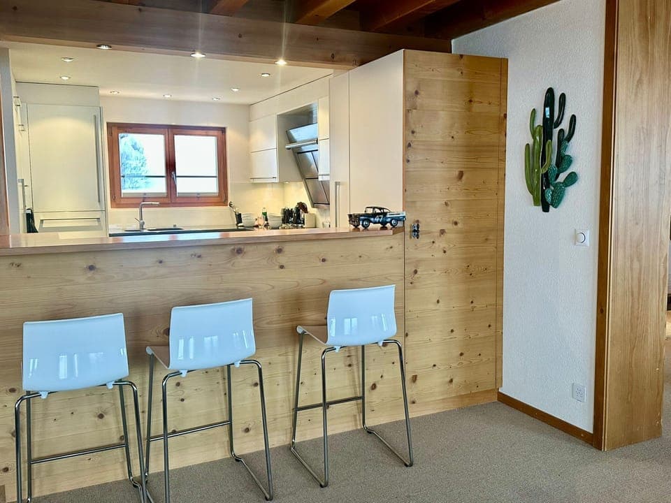 kitchen with a bar table island 