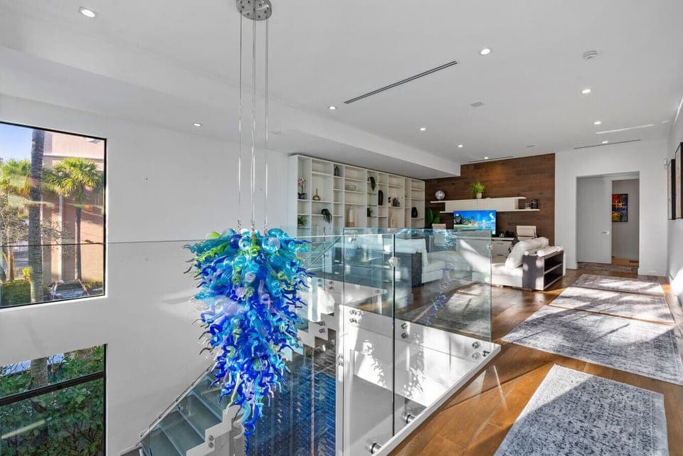 Statement chandelier anchors the airy mezzanine