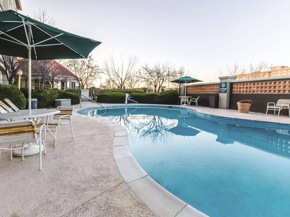 Soak up calm afternoons beside the expansive, crystal-clear pool.