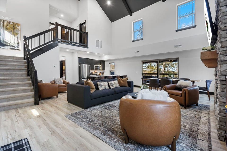 Spacious Open Floor Layout offers a Full Kitchen with Upgraded finishings and Appliances, a large Dining Table, a Cozy Living Area with a Streaming TV and a Fireplace, and a Total of 4 Bedrooms & 4 Baths