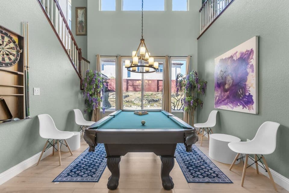 Spacious and stylish—perfect for relaxing or a friendly game night with a pool table and dartboard!