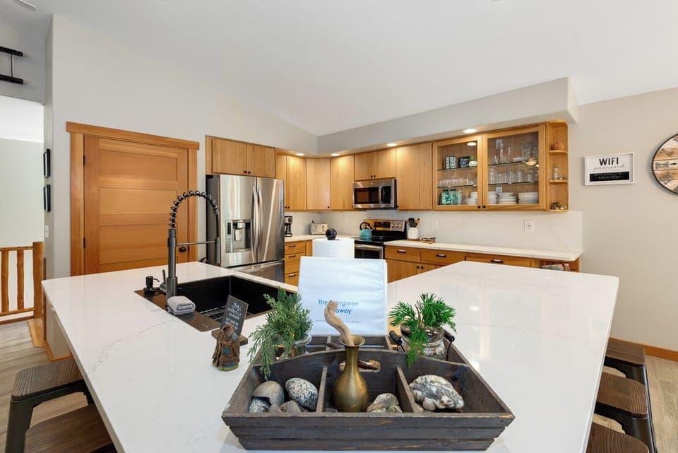 Full Kitchen with coffee maker, microwave, fridge, dishwasher, kettle, utensils