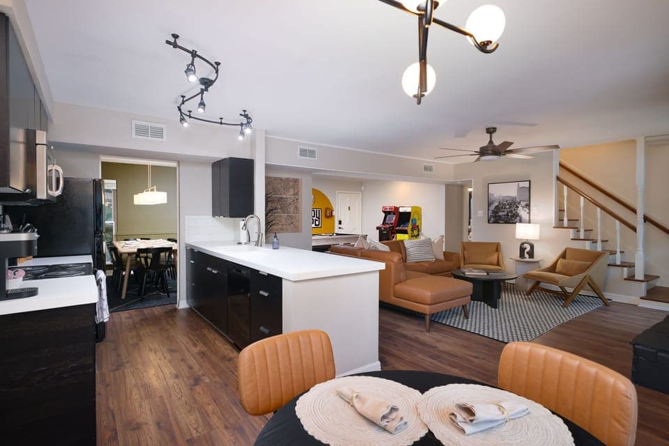 Experience open-concept living at its finest, where the living room, kitchen, and game room seamlessly come together.
