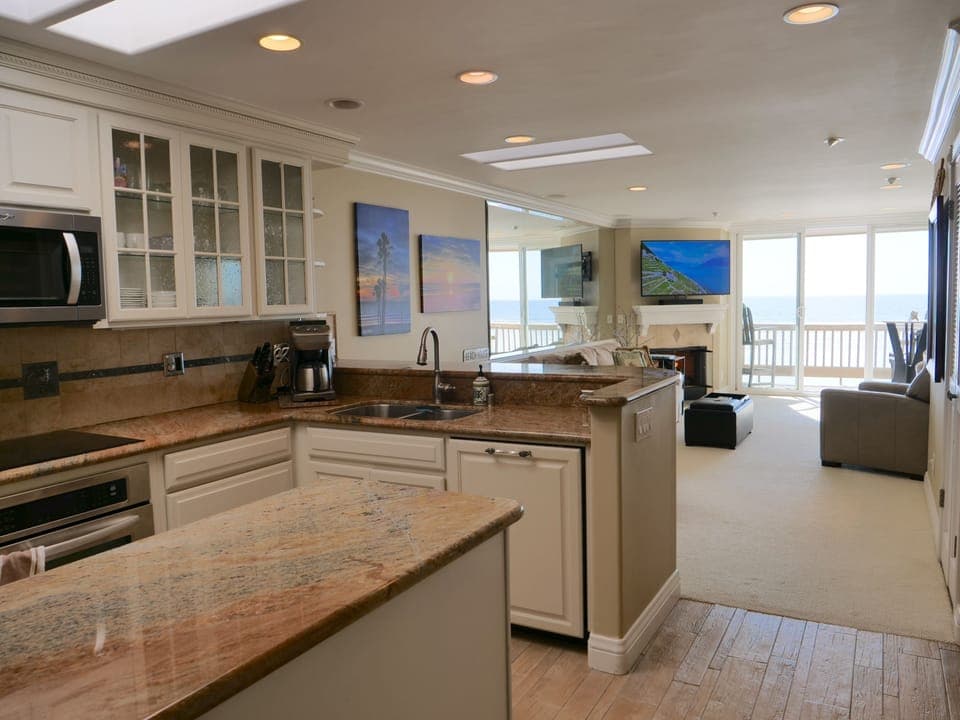 From front door looking past kitchen and into living room.