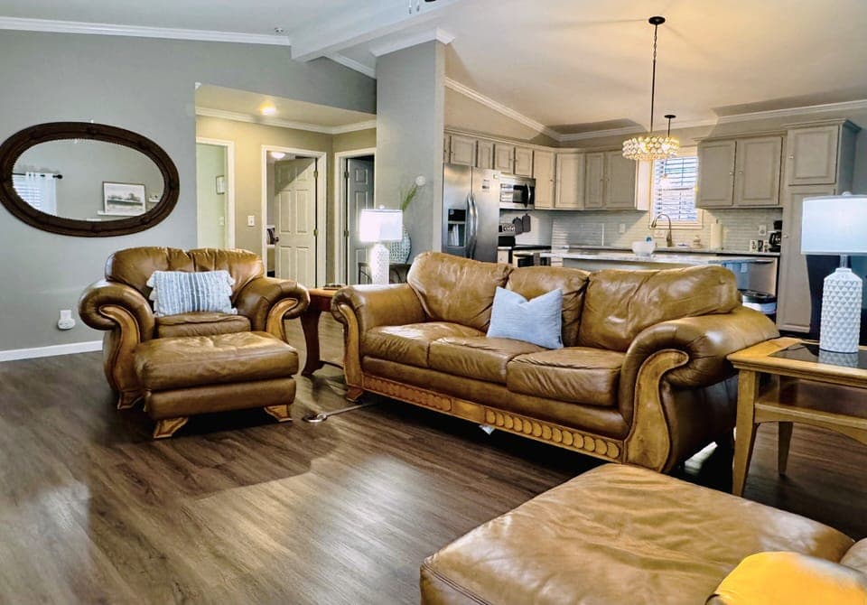 Welcome to the living room where the furniture practically begs you to relax.