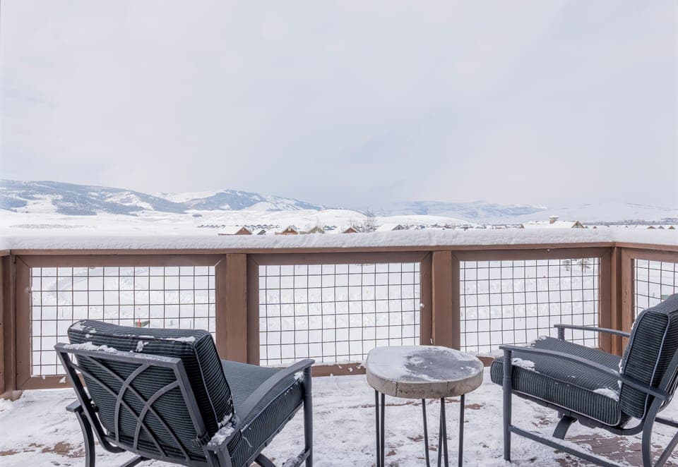 Enjoy breathtaking mountain views from the private balcony of the master bedroom