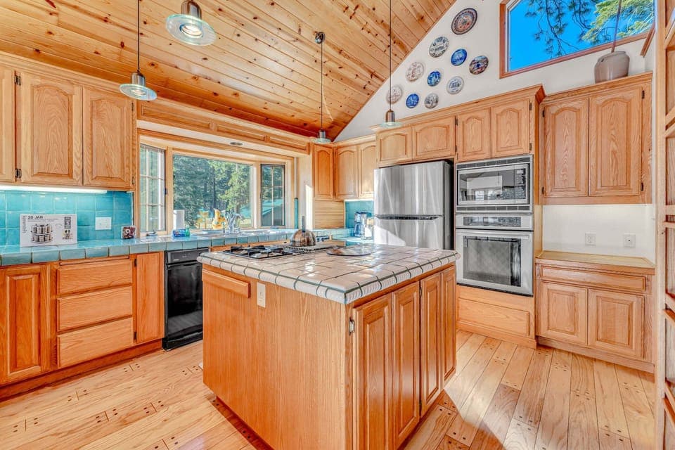 Kitchen: Drip coffee maker, espresso machine, cooking utensils, tableware, main floor