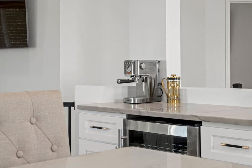 A cozy view of the coffee maker in the kitchen, ready to brew your perfect cup of coffee!