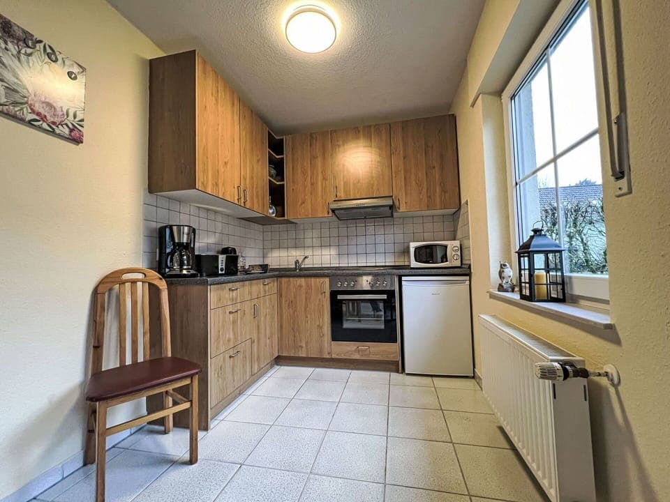 Furniture, Wood, Kitchen, Flooring, Interior Design, Cabinetry, Floor, Countertop, Major Appliance, Ceiling