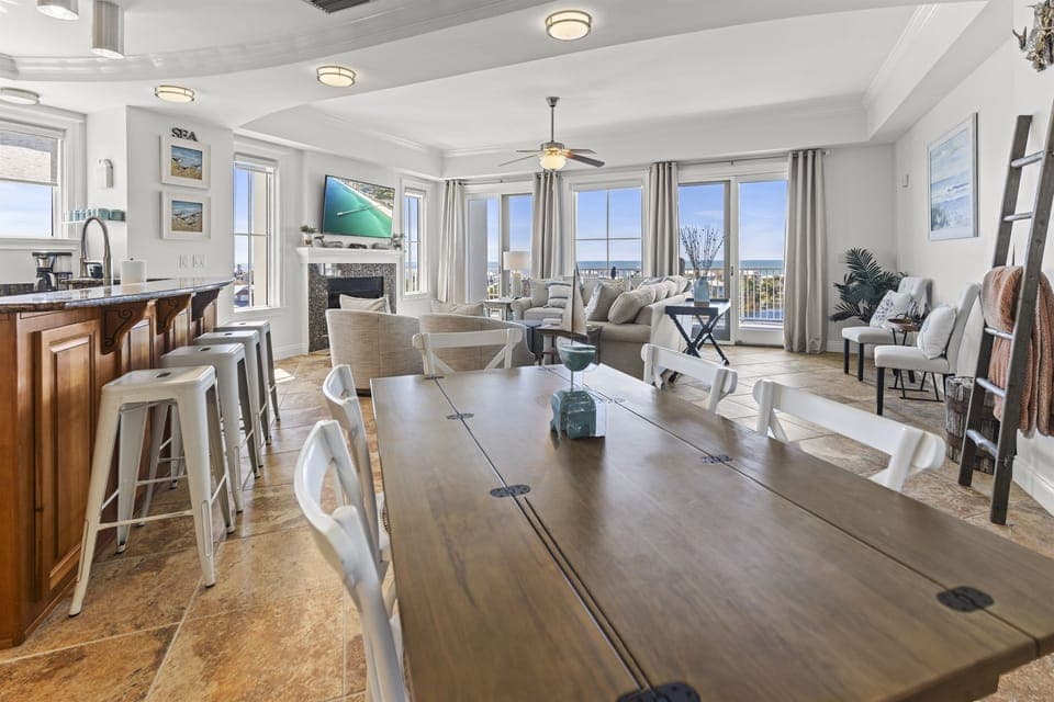 Your spacious open-plan retreat flows seamlessly from kitchen to dining to living, with stunning city views framing every moment of your stay.