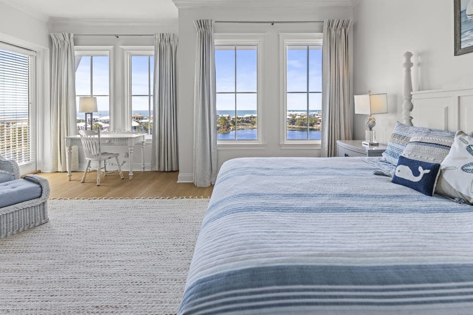 Wake up to breathtaking water views from your serene bedroom, where coastal charm meets comfort in every thoughtfully designed detail.