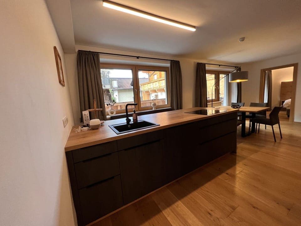 Tap, Cabinetry, Sink, Countertop, Plumbing Fixture, Bathroom Cabinet, Building, Houseplant, Window, Wood