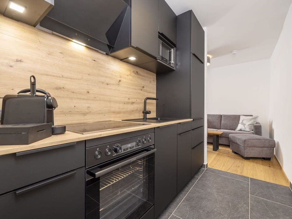 Cabinetry, Furniture, Property, Countertop, Building, Kitchen Stove, Kitchen, Kitchen Appliance, Wood, Cooktop