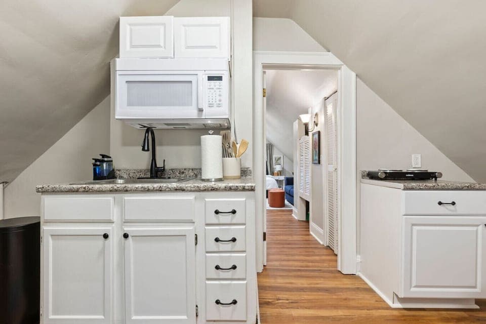 Bright kitchen with modern appliances, ready for your delicious creations.