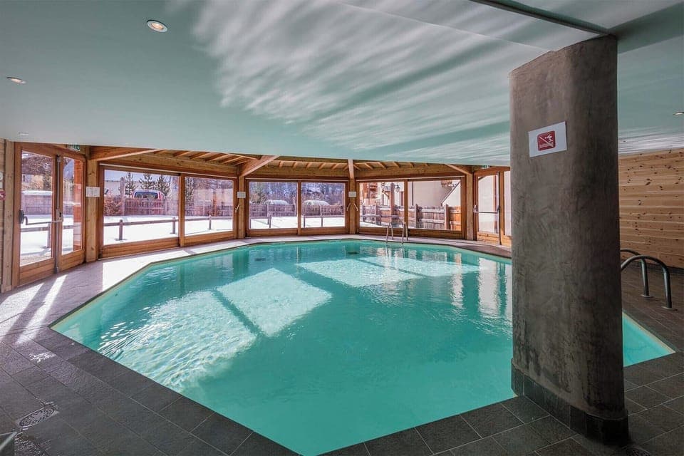 Enjoy a swim with a view! The large windows connect the indoor pool to the breathtaking mountain scenery.
