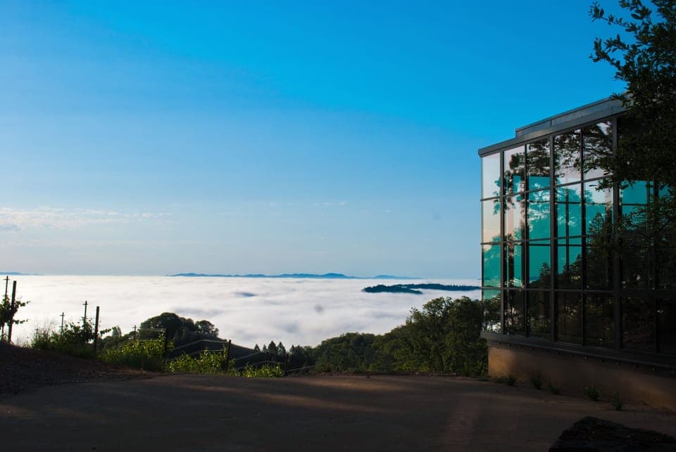 Morning fog at sunrise. Living room at the right