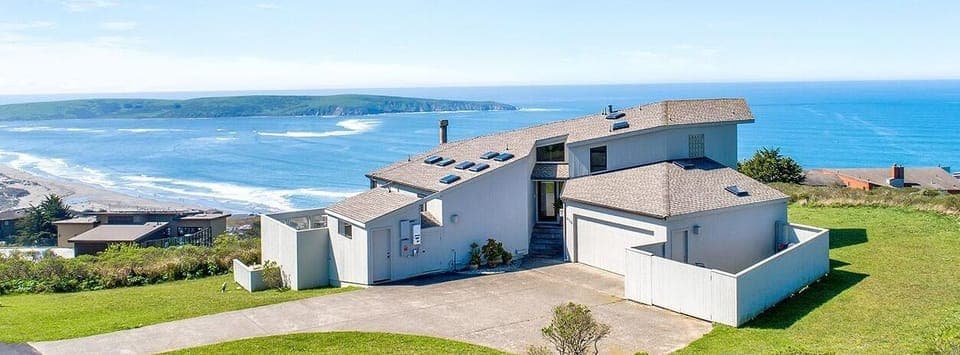 A breathtaking view of the property with its majestic backdrop.