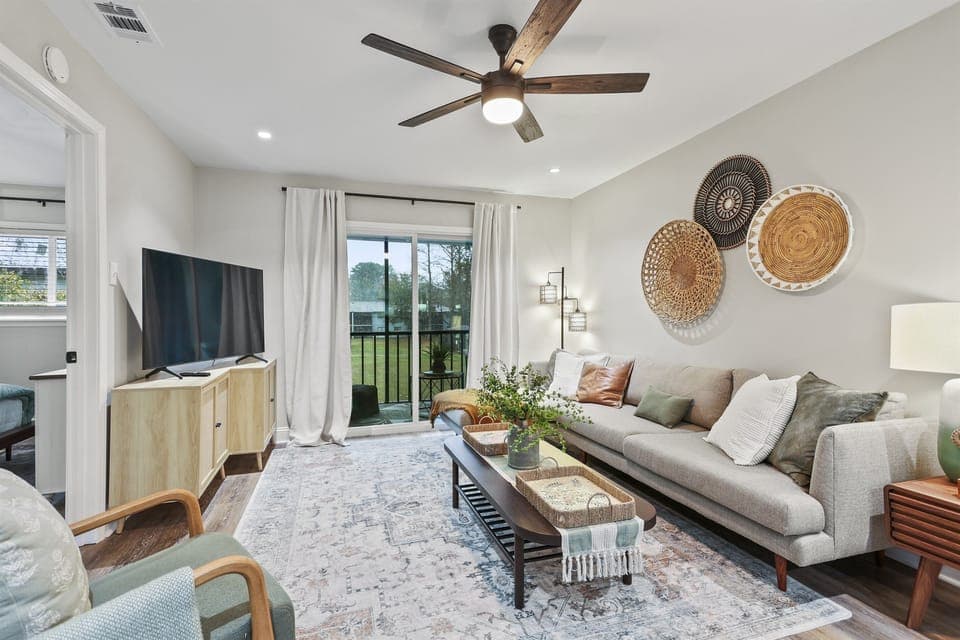 Unwind in this inviting living room, where soft seating meets a smart TV—perfect for movie nights or catching up on your favorite shows.