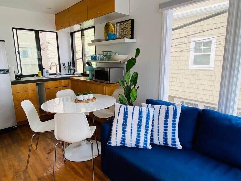 Sofa folds out into a sofa sleeper. Dining area seats four people.