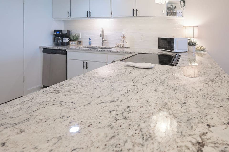 Spacious island for prepping meals or serving snacks—complete with beautiful coastal views to inspire every bite